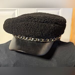 Steve Madden baker boy/newsboy cap style with a chain and faux leather brim